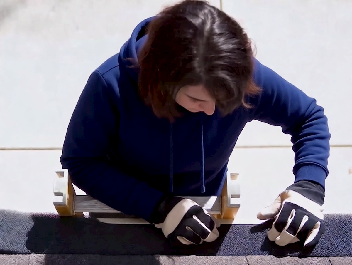 foam gutter guard woman working on the ladder