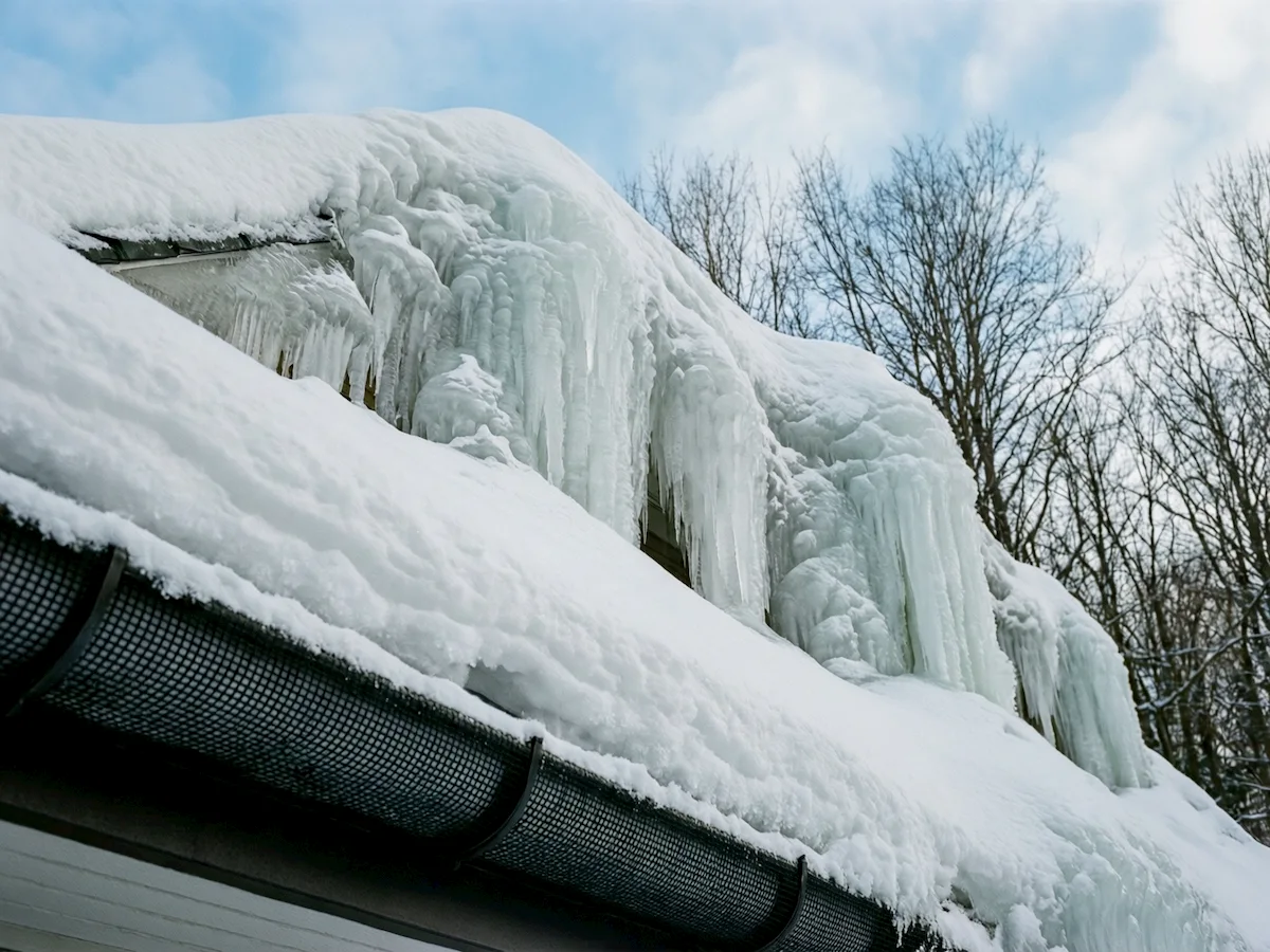 gutter guard covered by snow and ice